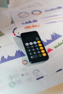 a remote control sitting on top of a table by Jakub Żerdzicki courtesy of Unsplash.