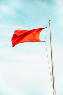 red flag by Carson Masterson courtesy of Unsplash.