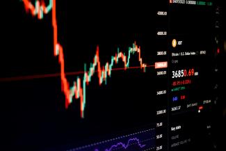 a computer screen displaying a stock market chart by lonely blue courtesy of Unsplash.