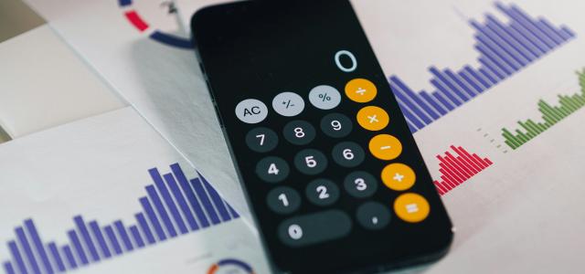 a remote control sitting on top of a table by Jakub Żerdzicki courtesy of Unsplash.