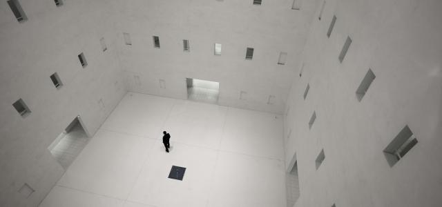 white and gray floor tiles by Jan Genge courtesy of Unsplash.