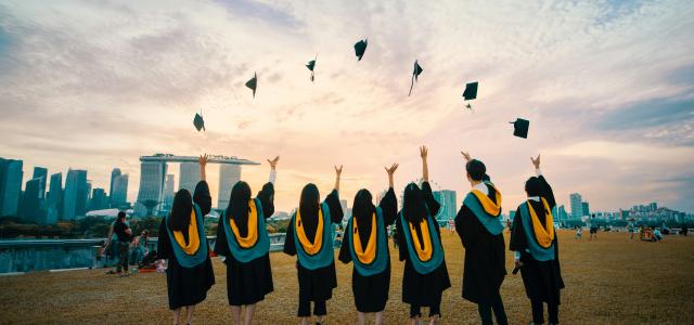 people throwing hats on air by Pang Yuhao courtesy of Unsplash.