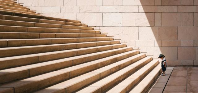 toddler's standing in front of beige concrete stair by Jukan Tateisi courtesy of Unsplash.