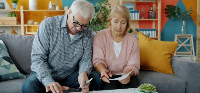 Elderly couple reviewing documents at home by Vitaly Gariev courtesy of Unsplash.